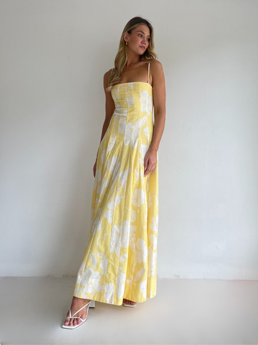 By Nicola Camille maxi dress in amarilla flor floral yellow print with delicate straps, perfect for weddings, summer events and garden parties