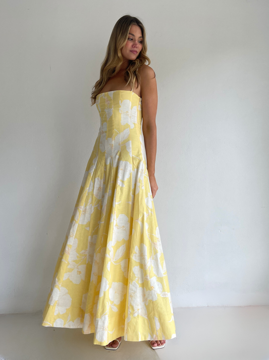 By Nicola Camille maxi dress in amarilla flor floral yellow print with delicate straps, perfect for weddings, summer events and garden parties