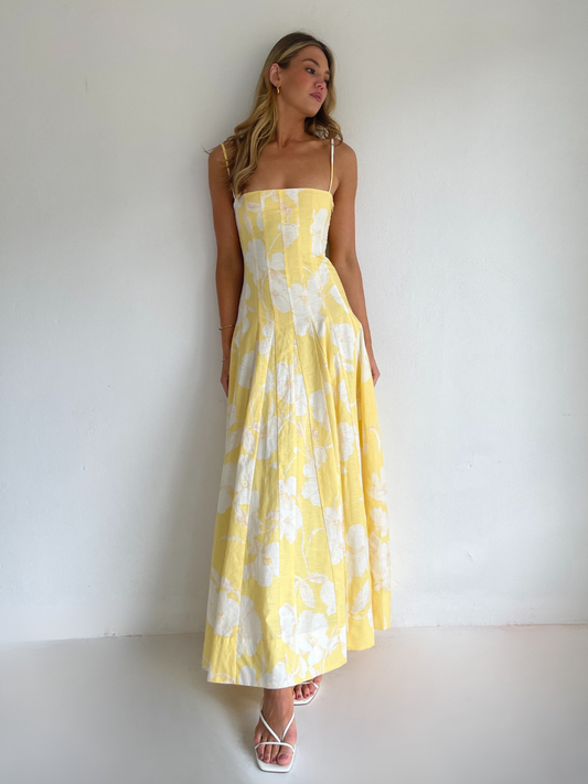 By Nicola Camille maxi dress in amarilla flor floral yellow print with delicate straps, perfect for weddings, summer events and garden parties