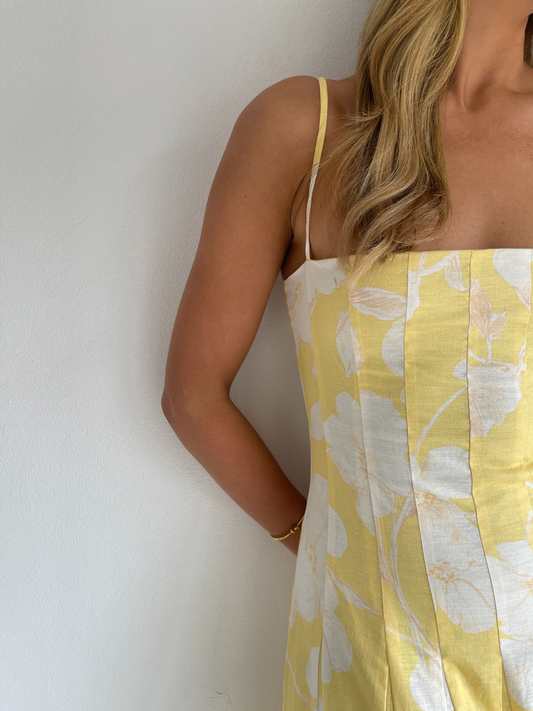 By Nicola Camille maxi dress in amarilla flor floral yellow print with delicate straps, perfect for weddings, summer events and garden parties